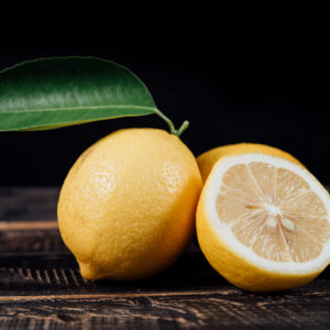 Sliced lemons on wood table